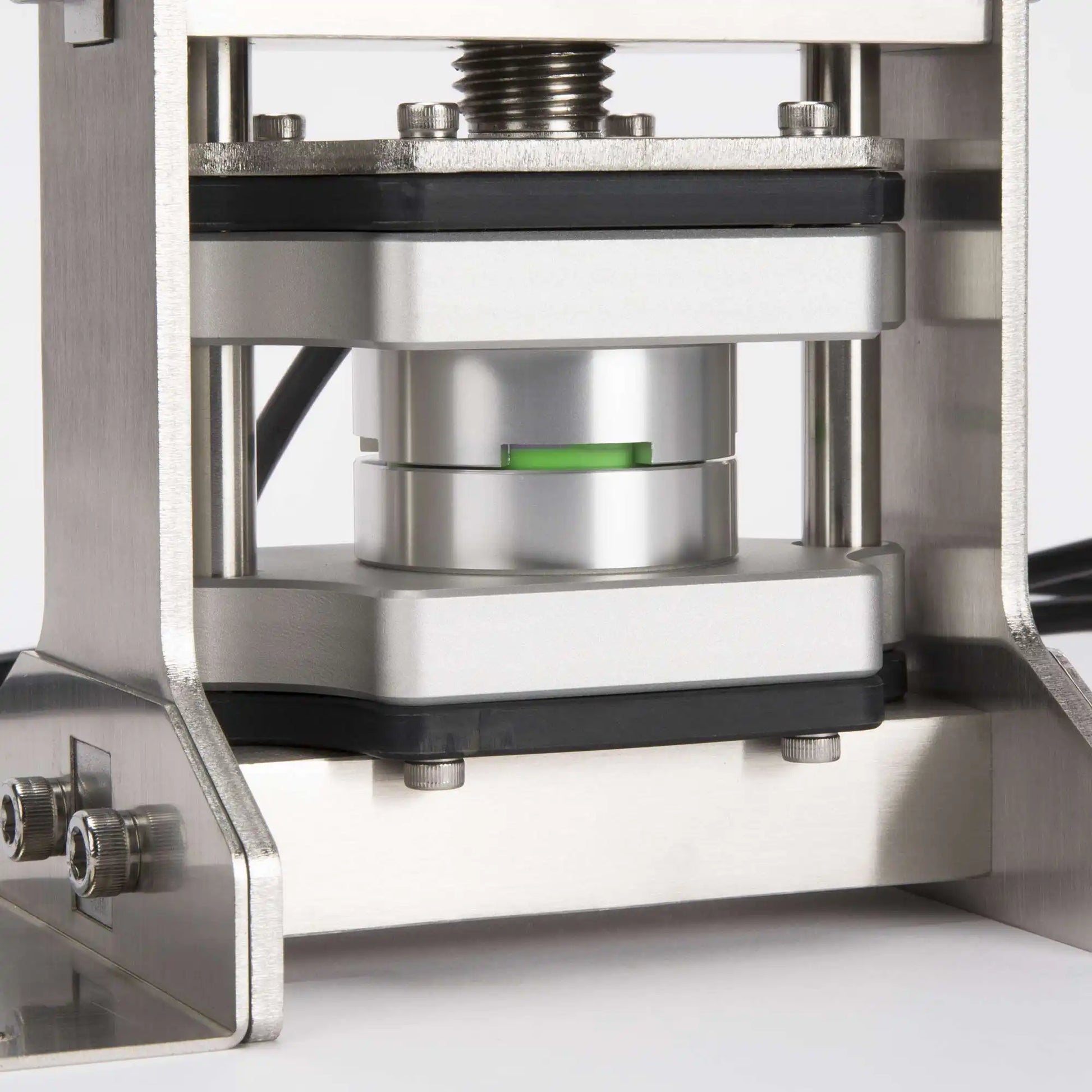 Mogobe Rosin Decarboxylation Capsule pair with 7ML Silicone Container, on a rosin press machine
